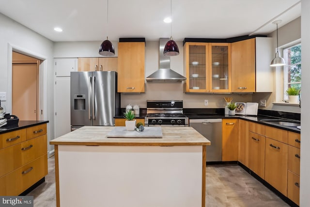 1407 Crestridge Dr, Silver Spring, MD 20910 - kitchen with appliances with stainless steel finishes, wall chimney range hood, hanging light fixtures, glass insert cabinets, and a center island