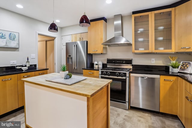 1407 Crestridge Dr, Silver Spring, MD 20910 - kitchen featuring appliances with stainless steel finishes, wall chimney exhaust hood, butcher block countertops, a kitchen island, and recessed lighting
