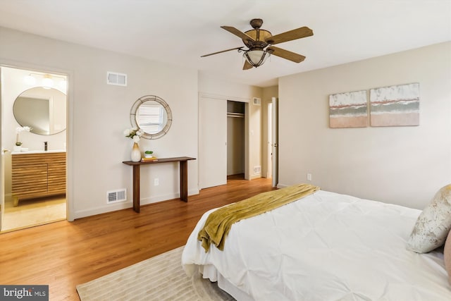 1407 Crestridge Dr, Silver Spring, MD 20910 - bedroom featuring wood finished floors, ensuite bath, a closet, and a ceiling fan