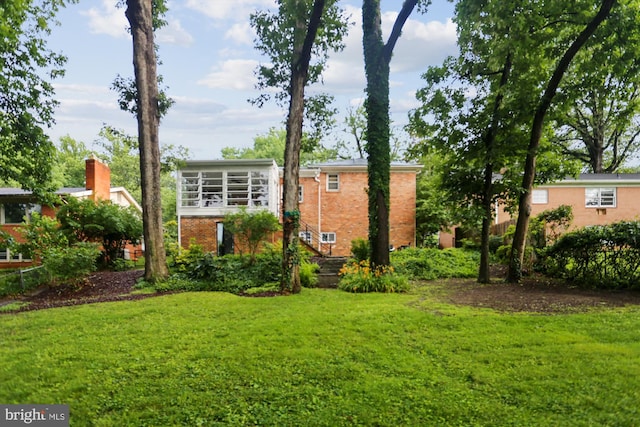 1407 Crestridge Dr, Silver Spring, MD 20910 - back of property featuring brick siding and a yard