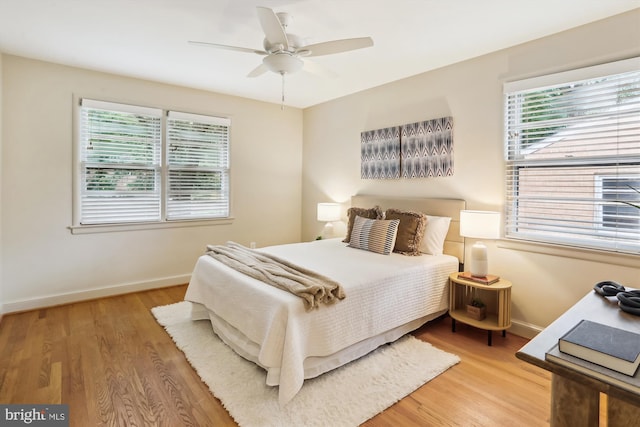 1407 Crestridge Dr, Silver Spring, MD 20910 - bedroom with multiple windows, light wood-style floors, and a ceiling fan