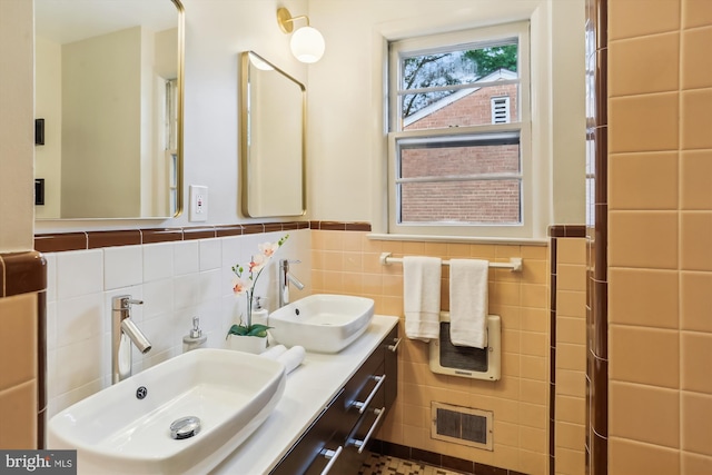 1407 Crestridge Dr, Silver Spring, MD 20910 - bathroom featuring tile walls, a wainscoted wall, and double vanity