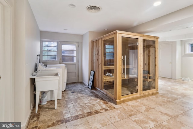 1407 Crestridge Dr, Silver Spring, MD 20910 - bathroom with washing machine and clothes dryer and recessed lighting