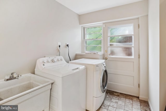 1407 Crestridge Dr, Silver Spring, MD 20910 - washroom featuring washer and clothes dryer and light stone finish floors