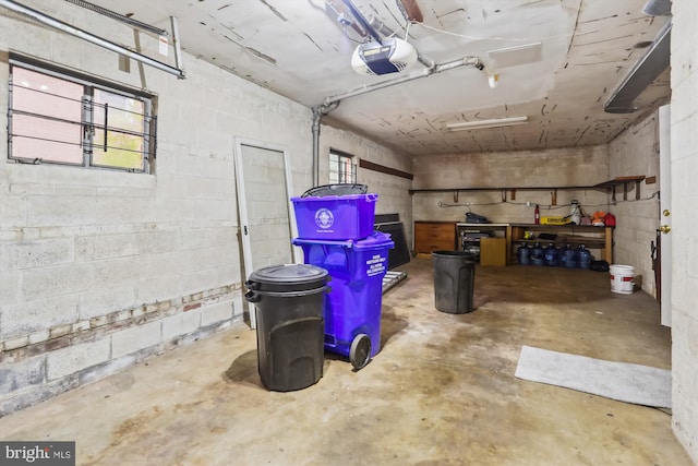 1407 Crestridge Dr, Silver Spring, MD 20910 - garage featuring a garage door opener and concrete block wall
