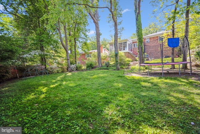 1407 Crestridge Dr, Silver Spring, MD 20910 - view of grassy yard with a trampoline