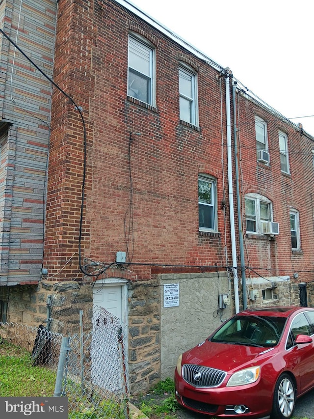 201 N 7th St, Darby, PA 19023 - view of side of property with brick siding and cooling unit