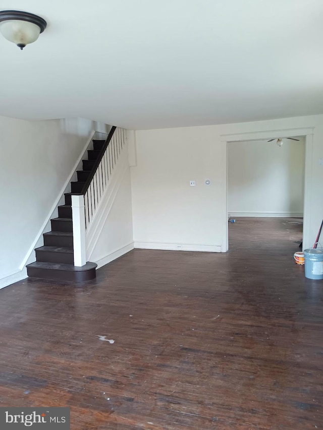 201 N 7th St, Darby, PA 19023 - unfurnished living room with stairs, wood finished floors, and ceiling fan