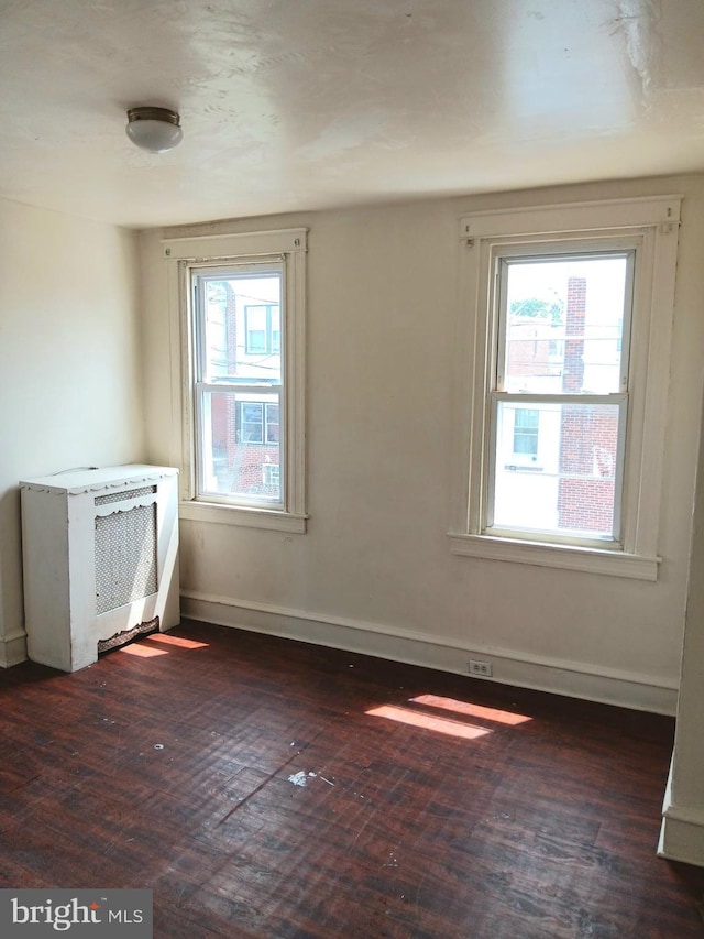 201 N 7th St, Darby, PA 19023 - spare room with dark wood finished floors and plenty of natural light