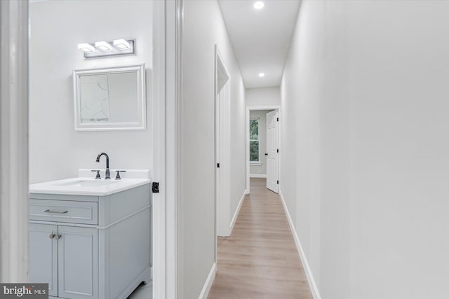 1635 Montpelier St, Baltimore, MD 21218 - hall featuring light wood-style floors and recessed lighting