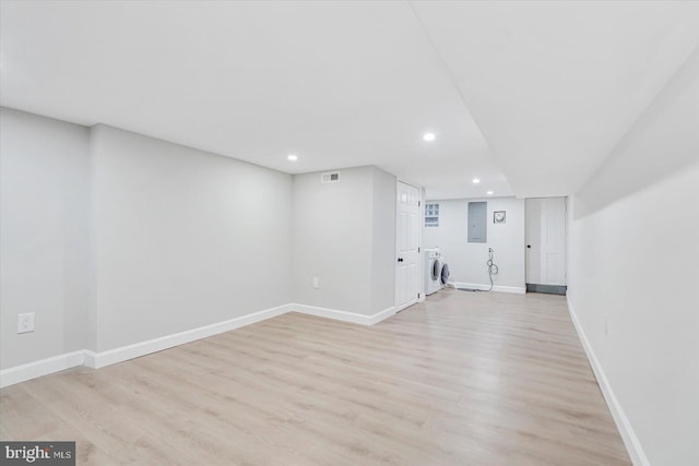 1635 Montpelier St, Baltimore, MD 21218 - unfurnished living room featuring washer / clothes dryer, recessed lighting, light wood-type flooring, and electric panel