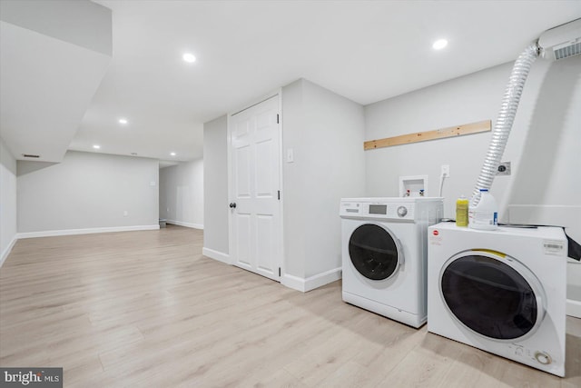 1635 Montpelier St, Baltimore, MD 21218 - laundry area featuring washing machine and dryer, light wood finished floors, and recessed lighting