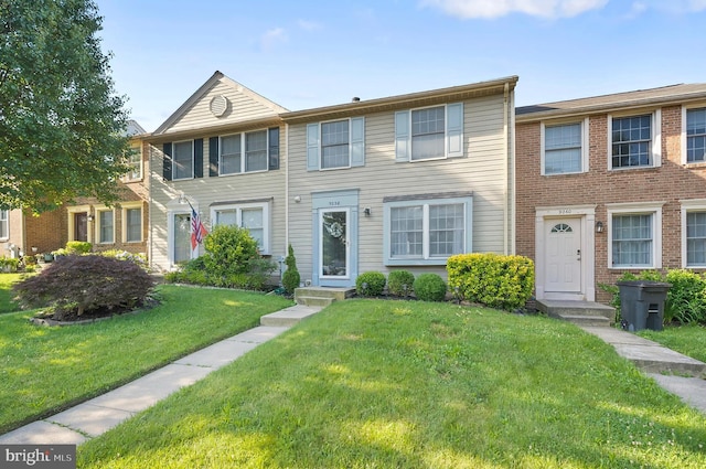 9258 Pirates Cv, Columbia, MD 21046 - townhome / multi-family property featuring a front yard
