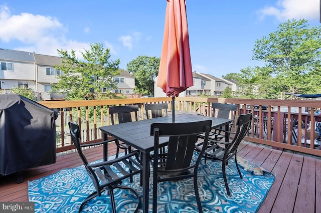 9258 Pirates Cv, Columbia, MD 21046 - wooden terrace featuring outdoor dining area and a residential view
