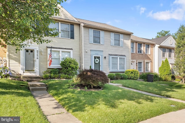 9258 Pirates Cv, Columbia, MD 21046 - townhome / multi-family property featuring a front lawn