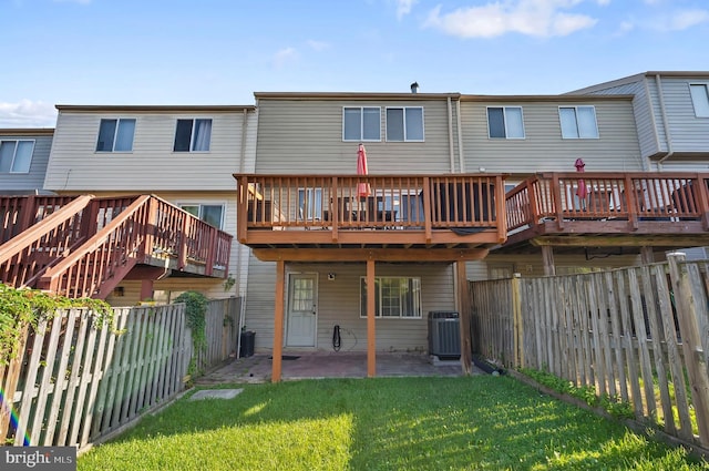 9258 Pirates Cv, Columbia, MD 21046 - back of property with a fenced backyard, a patio, and a wooden deck
