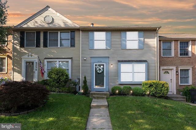9258 Pirates Cv, Columbia, MD 21046 - townhome / multi-family property with a front lawn