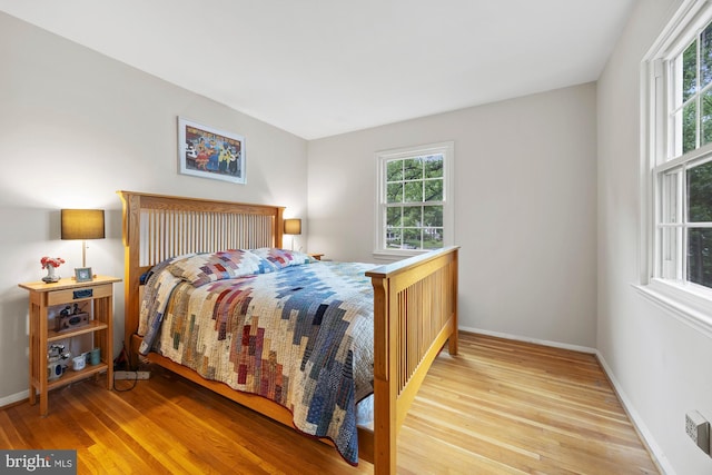 8306 Winslow Ave, Springfield, VA 22152 - bedroom with multiple windows and wood finished floors