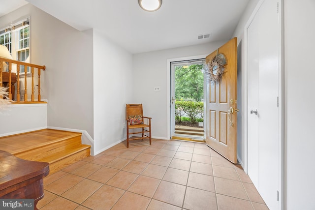 8306 Winslow Ave, Springfield, VA 22152 - foyer with light tile patterned floors and baseboards