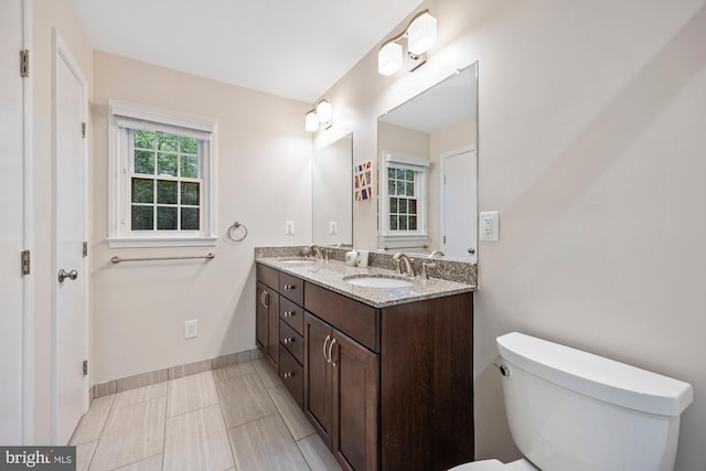 8306 Winslow Ave, Springfield, VA 22152 - bathroom with double vanity and toilet