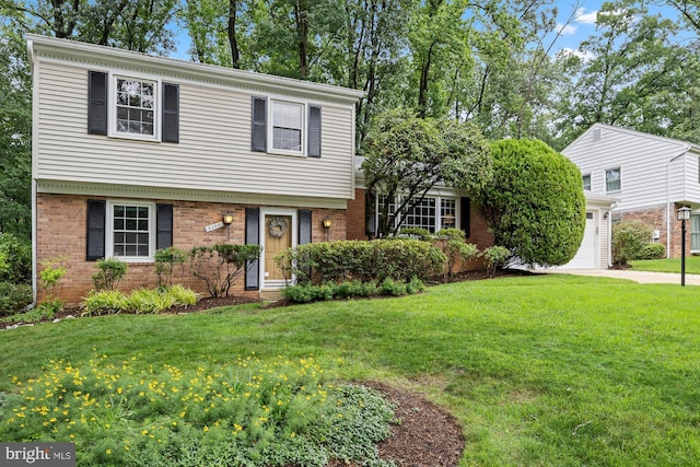 8306 Winslow Ave, Springfield, VA 22152 - colonial house with brick siding, a front lawn, concrete driveway, and a garage