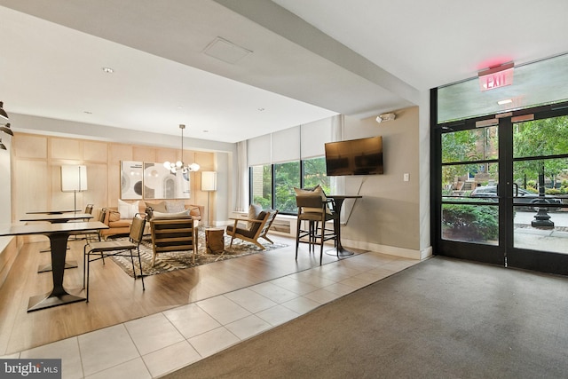 2030 F St NW Unit 111, Washington, DC 20006 - tiled dining room featuring a chandelier and baseboards