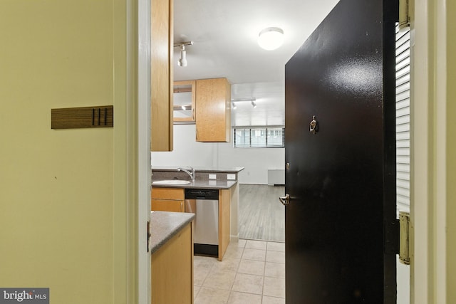 2030 F St NW Unit 111, Washington, DC 20006 - kitchen with dishwasher, light tile patterned floors, track lighting, and freestanding refrigerator