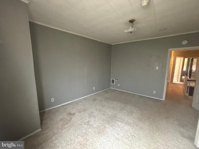 1115 E 11th St, Crum Lynne, PA 19022 - spare room featuring crown molding, carpet floors, and a smoke detector