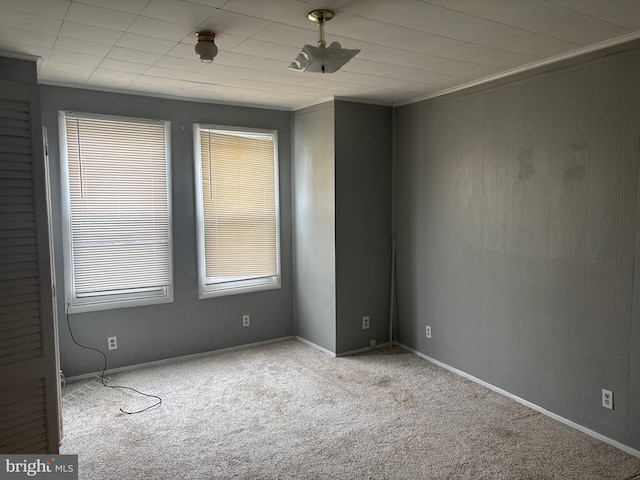 1115 E 11th St, Crum Lynne, PA 19022 - carpeted spare room with wooden walls and baseboards