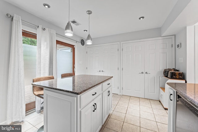 3436 Caledonia Cir, Woodbridge, VA 22192 - kitchen with white cabinets, dishwasher, dark stone countertops, light tile patterned floors, and recessed lighting