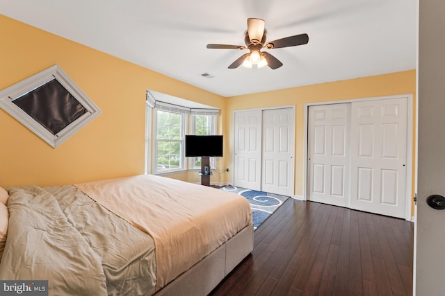 3436 Caledonia Cir, Woodbridge, VA 22192 - bedroom featuring two closets, dark wood-style flooring, and a ceiling fan