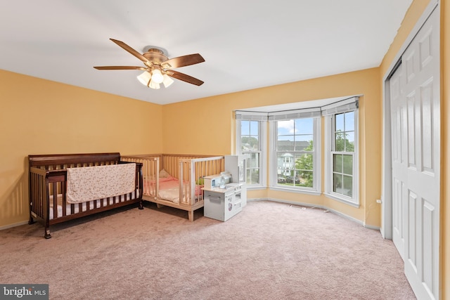 3436 Caledonia Cir, Woodbridge, VA 22192 - carpeted bedroom featuring a closet, ceiling fan, and a nursery area