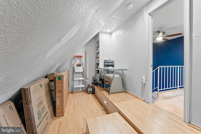 3436 Caledonia Cir, Woodbridge, VA 22192 - bonus room with a textured ceiling, wood finished floors, ceiling fan, a textured wall, and vaulted ceiling