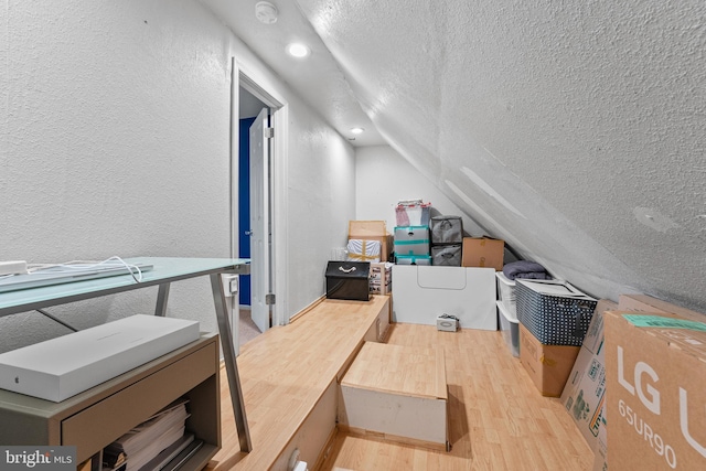 3436 Caledonia Cir, Woodbridge, VA 22192 - additional living space with a textured ceiling, a textured wall, light wood-style floors, lofted ceiling, and recessed lighting