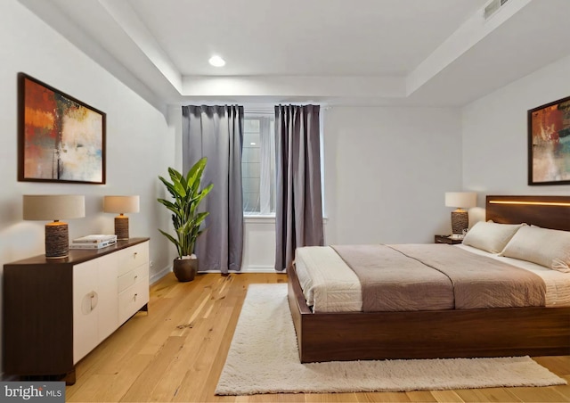 2538 W Girard Ave Unit A, Philadelphia, PA 19130 - bedroom featuring light wood-type flooring, recessed lighting, and a tray ceiling