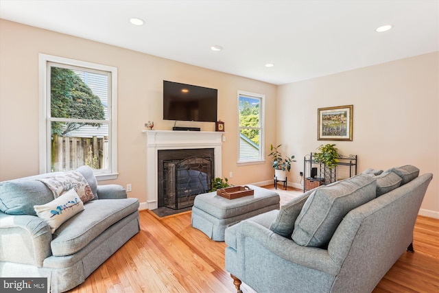 9505 Columbia Blvd, Silver Spring, MD 20910 - living room with a fireplace with flush hearth, light wood finished floors, and recessed lighting