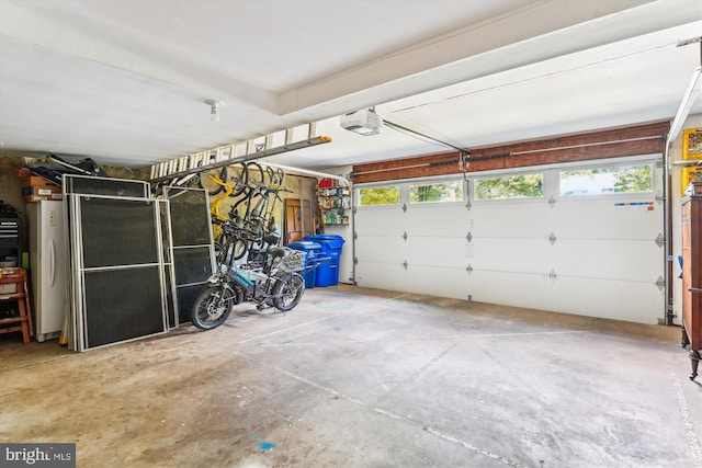9505 Columbia Blvd, Silver Spring, MD 20910 - garage with a garage door opener and freestanding refrigerator
