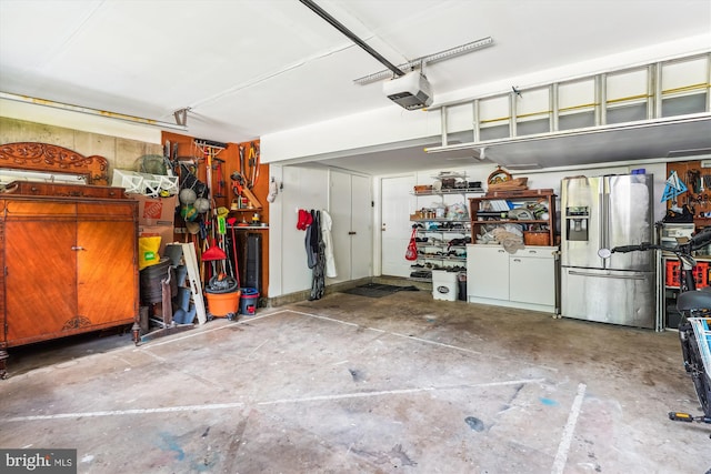 9505 Columbia Blvd, Silver Spring, MD 20910 - garage featuring stainless steel refrigerator with ice dispenser and a garage door opener