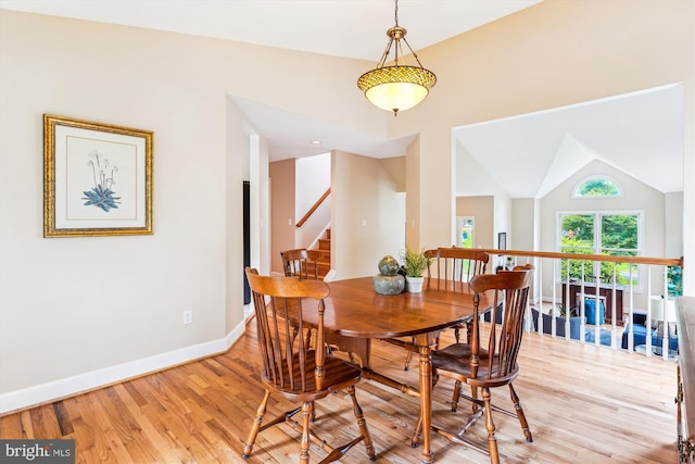 9505 Columbia Blvd, Silver Spring, MD 20910 - dining area with light wood finished floors, lofted ceiling, and stairway