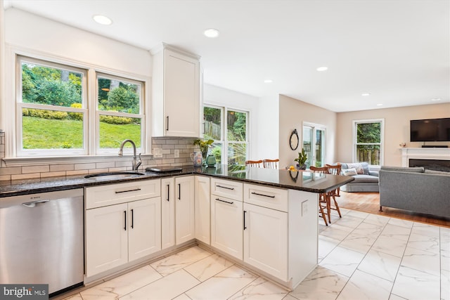 9505 Columbia Blvd, Silver Spring, MD 20910 - kitchen featuring dishwasher, light marble finish floors, open floor plan, recessed lighting, and a peninsula
