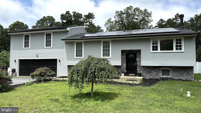 215 Spring Garden Rd, Hammonton, NJ 08037 - raised ranch with an attached garage, a front yard, solar panels, and driveway