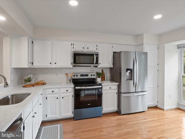 6427 Brass Button Ct, Centreville, VA 20121 - kitchen featuring appliances with stainless steel finishes, white cabinets, decorative backsplash, light countertops, and recessed lighting
