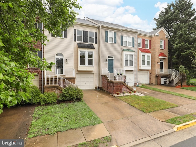 6427 Brass Button Ct, Centreville, VA 20121 - multi unit property with stairs, driveway, a garage, and brick siding