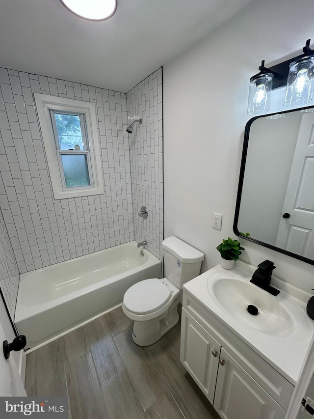 1239 Guildford Rd, Glen Burnie, MD 21060 - bathroom featuring vanity, shower / tub combination, and wood finished floors