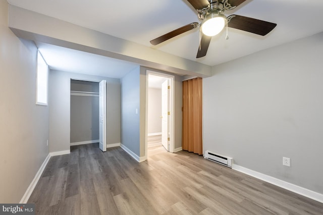 1537 Havilland Pl, Frederick, MD 21702 - unfurnished bedroom with a baseboard heating unit, wood finished floors, a closet, and ceiling fan