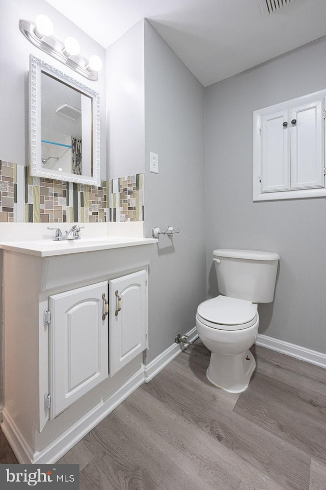 1537 Havilland Pl, Frederick, MD 21702 - bathroom with wood finished floors, decorative backsplash, and vanity