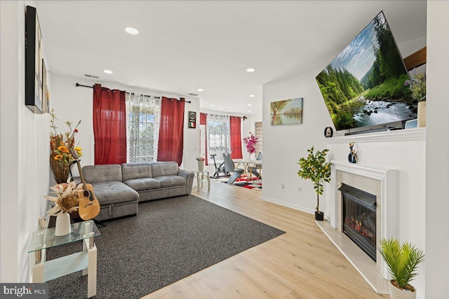121 Kyle Way, Ewing, NJ 08628 - living area featuring wood finished floors, recessed lighting, and a glass covered fireplace
