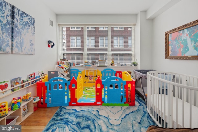 1425 Locust St Unit 5C, Philadelphia, PA 19102 - bedroom with multiple windows and wood finished floors