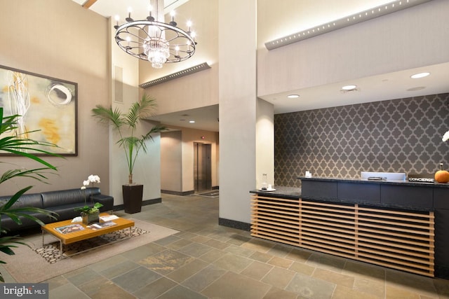 1425 Locust St Unit 5C, Philadelphia, PA 19102 - reception featuring a high ceiling, a community bar, and a chandelier