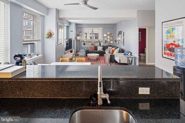 1425 Locust St Unit 5C, Philadelphia, PA 19102 - kitchen with ceiling fan, plenty of natural light, dark stone counters, and open floor plan